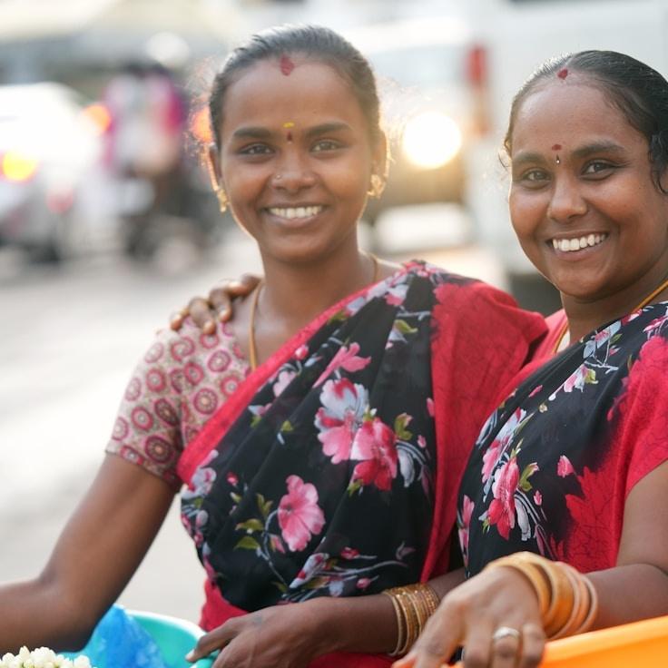 Avery Singh, Lead Design Curator at CrystalGardenValley, reviewing corporate floral arrangements